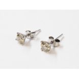 A pair of import marked 750 white gold diamond solitaire stud ear-rings - 1.01ct. TDW