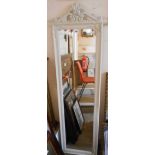 A modern full length dressing mirror with decorative pierced pediment, cream finish frame and
