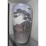 A Royal Copenhagen vase decorated with a hand painted panoramic coastal scene