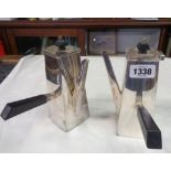 A pair of Art Deco silver plated side-pour chocolate pots with ebony knops and handles
