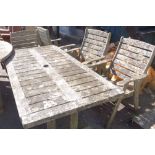 A Clarecraft wooden garden table and a set of four chairs