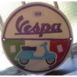 A modern painted cast metal Vespa sign