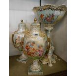 A 19th Century porcelain garniture in the Dresden style comprising comport and pair of lidded urns