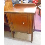 A 24" early 20th Century walnut and strung cabinet with shelves enclosed by a panelled door, set