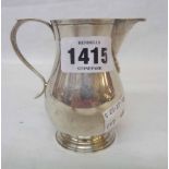 A small silver Georgian style baluster cream jug - base marks Birmingham 1962