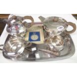 An Art Deco Walker & Hall silver plated four piece tea set, cake slice and watch booklet, on later
