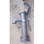 A modern cast metal garden pump