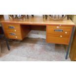 A 1.36m vintage teak effect knee-hole office desk with two short drawers and flanking locking file