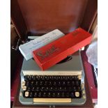 A vintage cased Imperial Good Companion Model 7 typewriter - sold with two boxed cleaning sets
