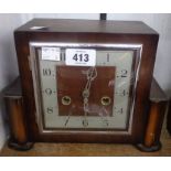 A vintage stained oak cased Smiths Enfield mantle clock with eight day gong striking movement