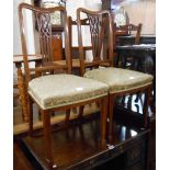 A pair of Edwardian mahogany and strung framed dining chairs with pierced splat backs and