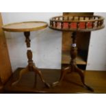 Two reproduction pedestal wine tables, one with gallery top, both set on turned pillar and tripod