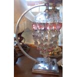 A chrome Art Deco lamp with pink and clear glass drop chandelier style shade