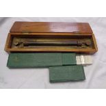 A mahogany cased parallel rule and a boxed slide rule