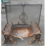 A Victorian iron dog fire grate with Gothic style supports - sold with a fire screen