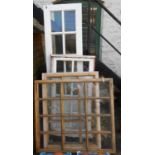Two window panels part glazed with bull's-eye plate glass panes - sold with painted wood window