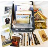 A shoebox containing a collection of mid to late 20th Century postcards, including topographic, many