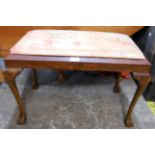 A stained beech dressing stool with drop-in seat, set on cabriole legs with claw and ball feet