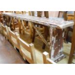 An 85cm old pine form bench with remains of painted finish, set on braced standard ends