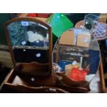 Two vintage dressing table mirrors, one with bevelled plate, the other frameless with milled edge,