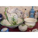 A Victorian china jug and bowl set with chamber pot and soap dish, the spout and handle of the jug