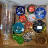 A collection of bubble glass and other paperweights, modern glass ship in a bottle and other small
