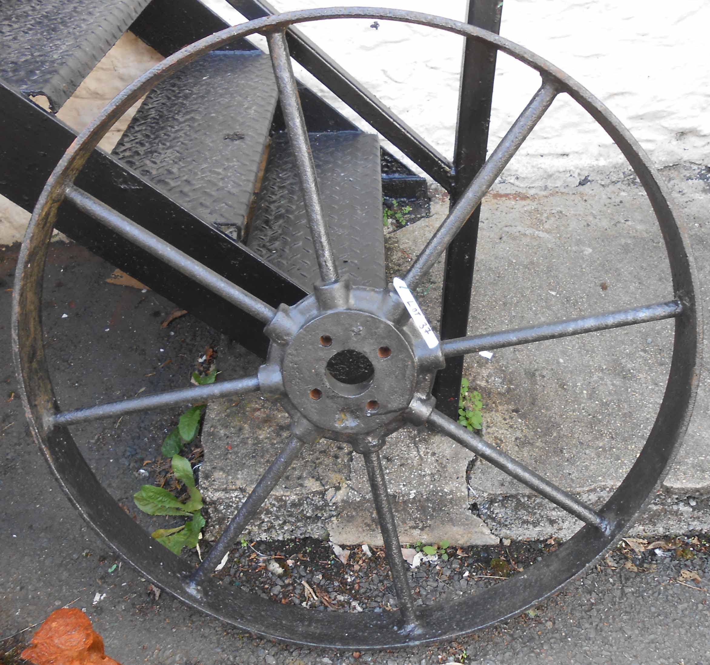 An 86.5cm diameter cast iron drive wheel