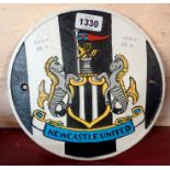 A painted iron Newcastle United sign