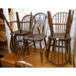 Three similar wheel back kitchen chairs and three similar hoop stick back kitchen chairs, all with