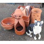 A selection of modern terracotta bowls, oblong planters, conical planter, figural planter and