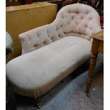 A 1.47m 20th Century chaise longue with button back upholstery, set on turned legs with brass caps