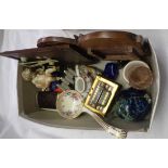 A small box containing a quantity of collectables including putti, snuff box, glass, etc. -