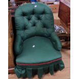 A Victorian nursing chair with later button back upholstery, set on turned front legs with porcelain