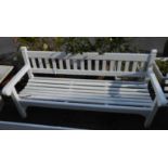 A 1.83m painted wood slat back garden bench, set on square supports