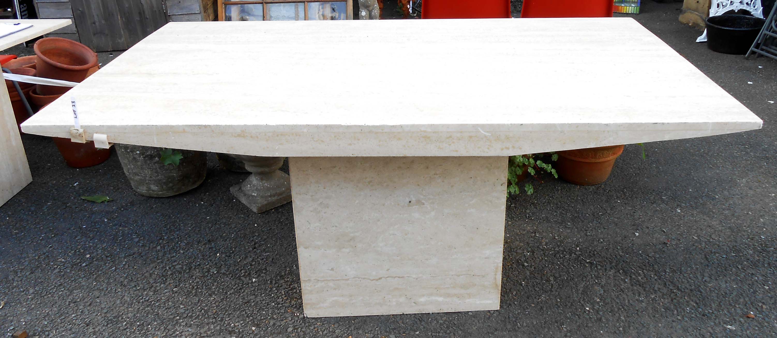 A 1.7m polished Travertine limestone dining table, set on square pedestal base - top cracked