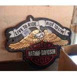 A reproduction painted cast metal Harley Davidson sign