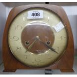 A vintage Smiths walnut cased mantle clock with eight day gong striking movement