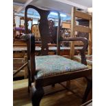 A set of six Edwardian walnut framed Queen Anne style dining chairs with remains of upholstered