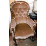 A Victorian mahogany part show frame spoon back armchair with button back upholstery, set on