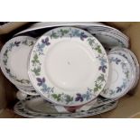 A Royal Doulton Burgundy pattern part tea and dinner service including bowls, cups and saucers,
