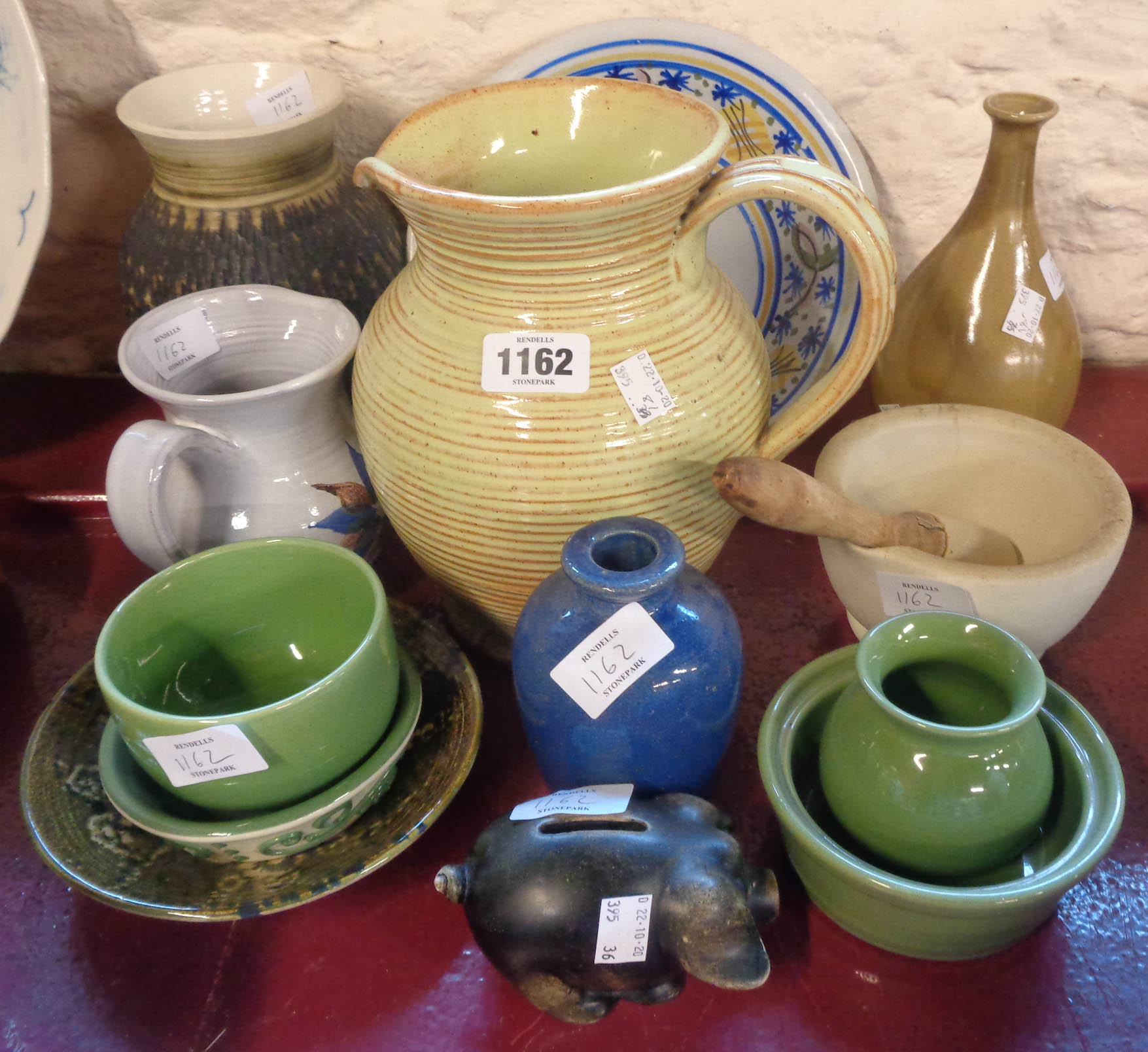 A selection of studio and other ceramics including Brannam items, vintage pestle and mortar, etc.