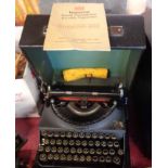 A cased Imperial Good Companion typewriter with instruction book