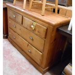 A 1.04m late Victorian pitch pine chest of two short and two long graduated drawers, set on plinth