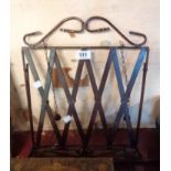 A wrought metal table reading stand