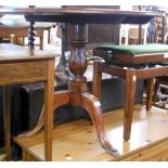 An 88cm diameter 19th Century stained mixed wood tilt-top table, set on turned pillar and tripod