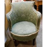 A vintage boudoir tub elbow chair with remains of tapestry upholstery, set on square legs