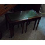 A reproduction mahogany coffee table with two nesting tea tables - wear