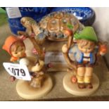 A pair of Hummel figures of a boy and a girl - sold with a boxed Wade tortoise