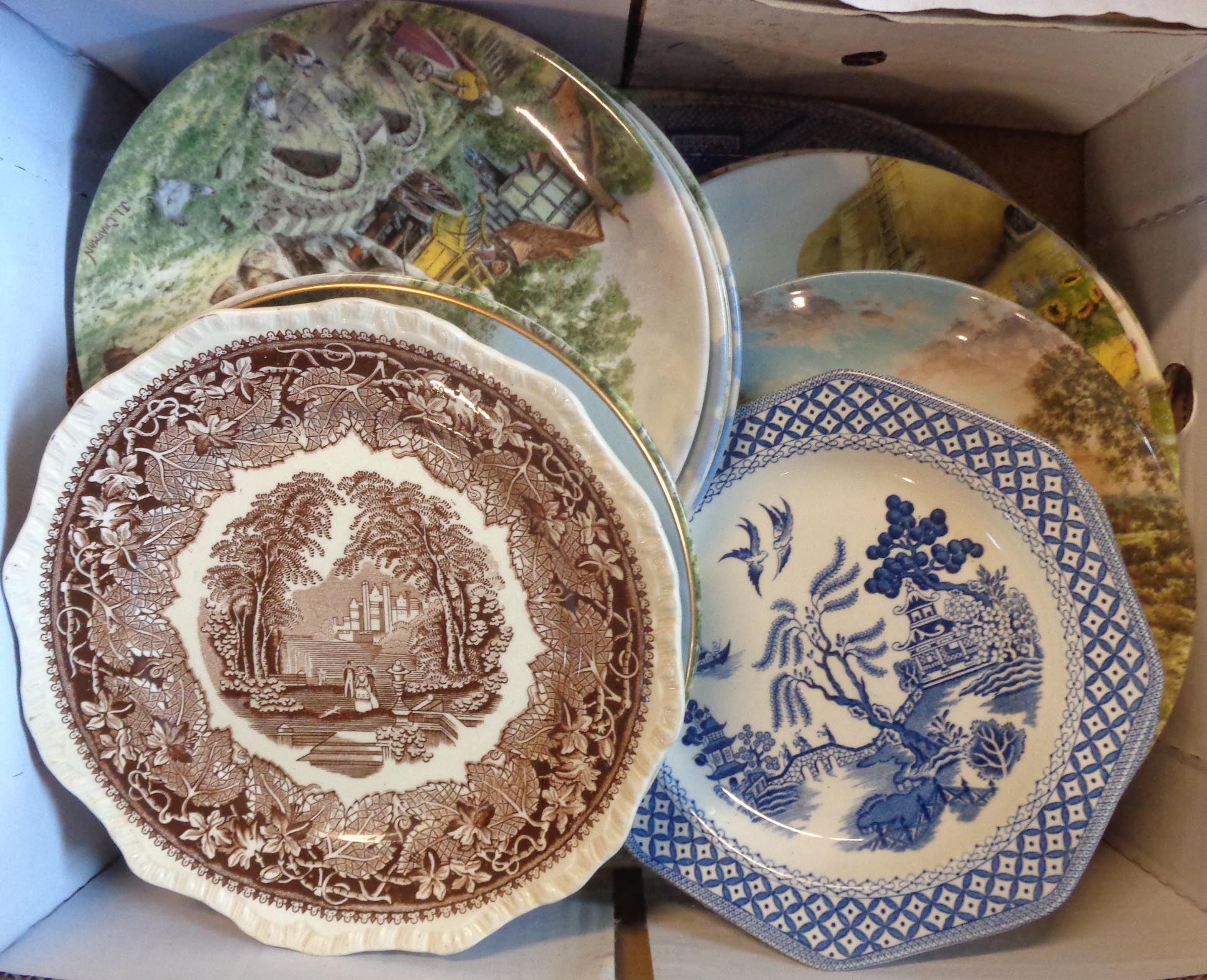 A box containing assorted china including blue and white meat plates, collectors' plates, etc.