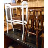 A stained wood bar stool with turned supports - sold with a painted wood double towel rail with